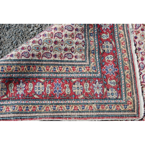 357 - Antique Turkish hand-knotted rug with all over floral and geometric motifs, on a red, blue and cream... 