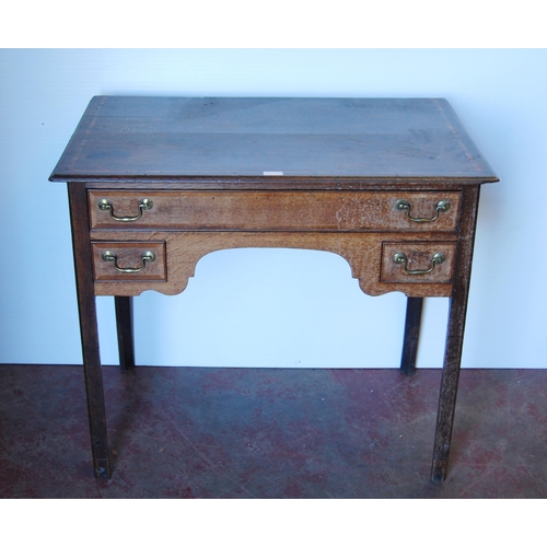 410 - Georgian oak lowboy, the inlaid crossbanded top above a long drawer and shaped apron flanked by shor... 