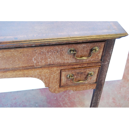 410 - Georgian oak lowboy, the inlaid crossbanded top above a long drawer and shaped apron flanked by shor... 