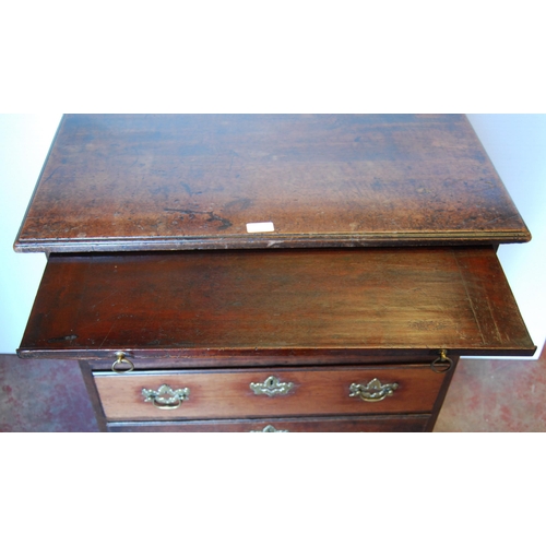 411 - George III mahogany bachelor's chest of four graduated drawers with brushing slide, on bracket feet,... 