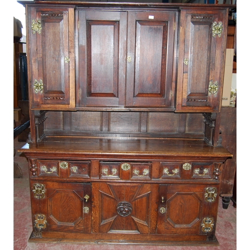 412 - 19th century oak dresser, the breakfront top section with four panelled doors enclosing a shelved in... 