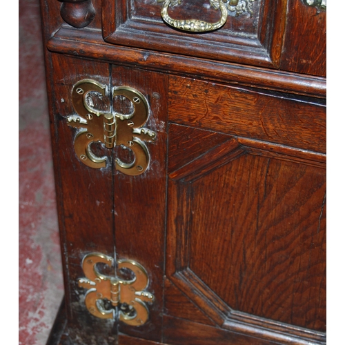 412 - 19th century oak dresser, the breakfront top section with four panelled doors enclosing a shelved in... 