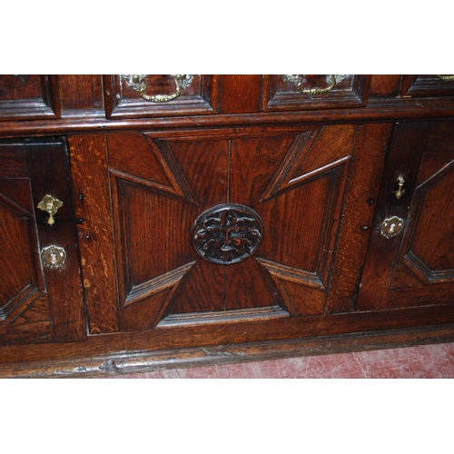 412 - 19th century oak dresser, the breakfront top section with four panelled doors enclosing a shelved in... 