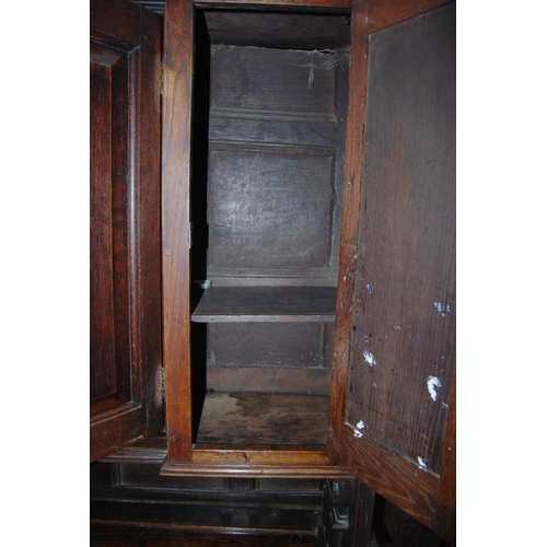 412 - 19th century oak dresser, the breakfront top section with four panelled doors enclosing a shelved in... 