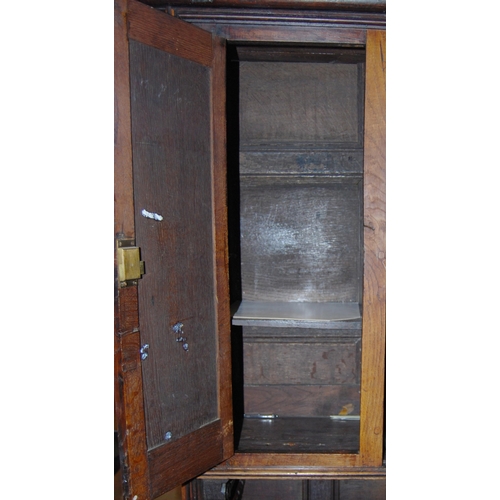 412 - 19th century oak dresser, the breakfront top section with four panelled doors enclosing a shelved in... 