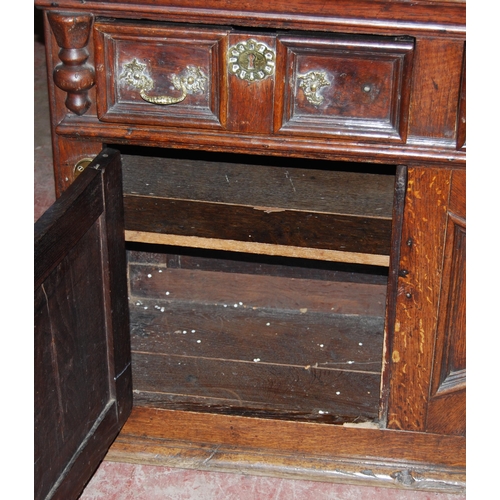 412 - 19th century oak dresser, the breakfront top section with four panelled doors enclosing a shelved in... 