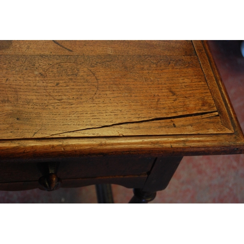 414 - English Arts & Crafts Oak writing table, the long drawer with ornate peg handles, on turned supp... 