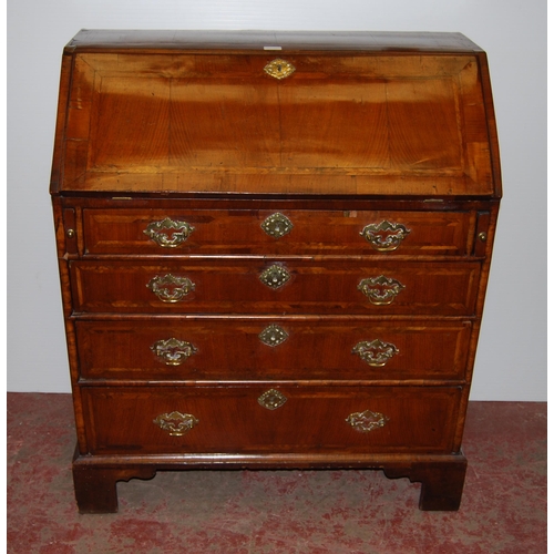 415 - 18th century walnut inlaid writing bureau, the fall front enclosing fitted drawers and pigeon holes ... 