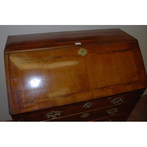 415 - 18th century walnut inlaid writing bureau, the fall front enclosing fitted drawers and pigeon holes ... 