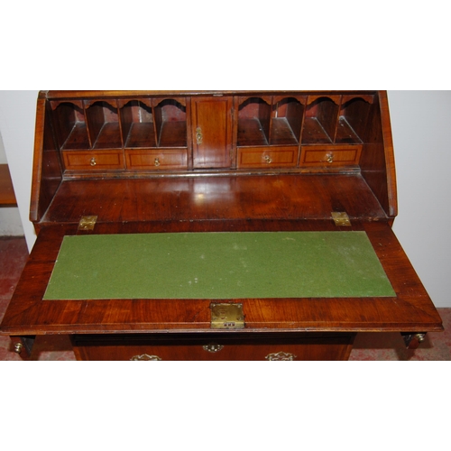 415 - 18th century walnut inlaid writing bureau, the fall front enclosing fitted drawers and pigeon holes ... 