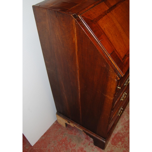 415 - 18th century walnut inlaid writing bureau, the fall front enclosing fitted drawers and pigeon holes ... 