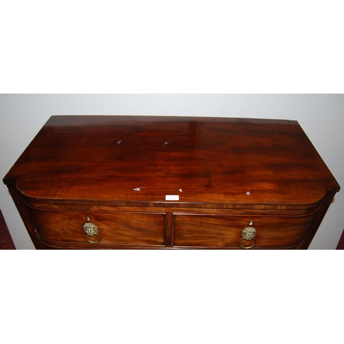 416 - William IV mahogany barrel-front chest of two short and three graduated long drawers, with brass lio... 