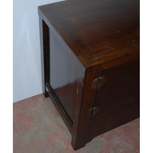 407 - Pair of Chinese elm cupboards (last quarter 20th century) of low form with two doors enclosing a she... 