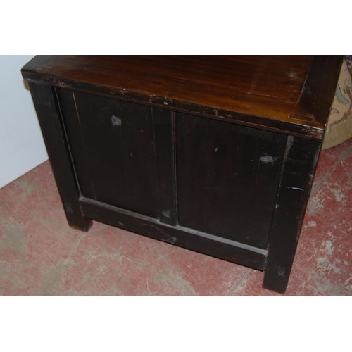 407 - Pair of Chinese elm cupboards (last quarter 20th century) of low form with two doors enclosing a she... 