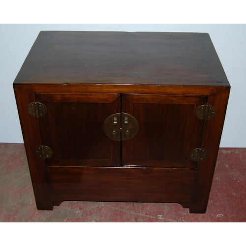 407 - Pair of Chinese elm cupboards (last quarter 20th century) of low form with two doors enclosing a she... 