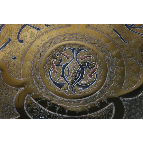 19 - Two brass decorative wall plates, larger with foliate decoration and scalloped well, 50cm diameter.