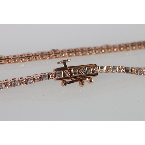 72 - 10ct rose gold bracelet set with baguette and round brilliant-cut diamonds, with open box clasp and ... 