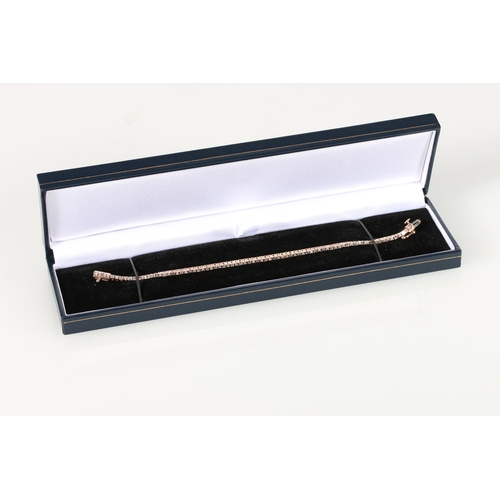 72 - 10ct rose gold bracelet set with baguette and round brilliant-cut diamonds, with open box clasp and ... 