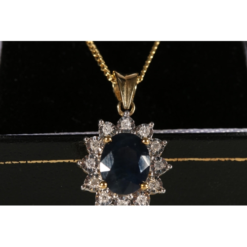 84 - 9ct yellow gold oval sapphire and diamond cluster pendant on a gold-coated silver chain, sapphire we... 