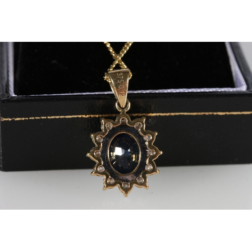 84 - 9ct yellow gold oval sapphire and diamond cluster pendant on a gold-coated silver chain, sapphire we... 