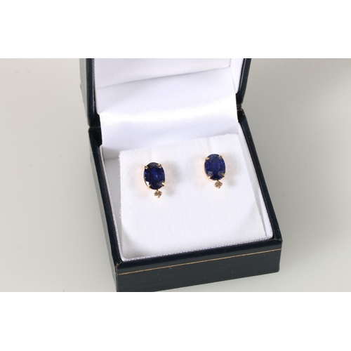 106 - Pair of 18ct yellow studs set with treated sapphires and diamonds, sapphire weight approximately 3ct... 