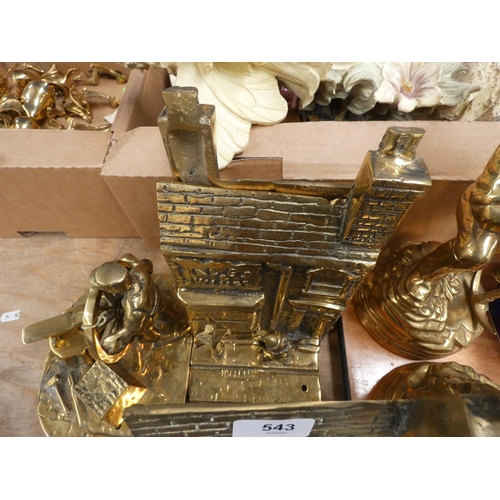 543 - Three brass bookends and a brass Blacksmith.