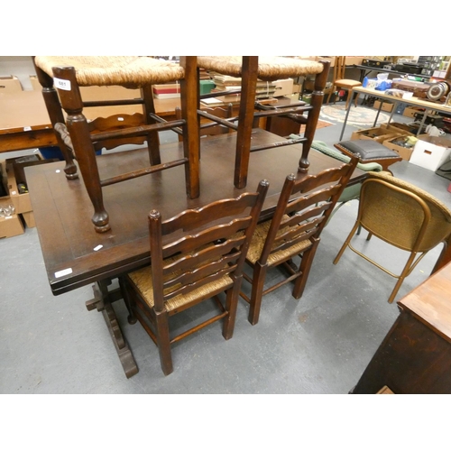 681 - Set of six rush seat ladder back dining chairs.