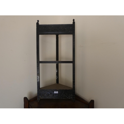 721 - Ebonised corner two tier unit.