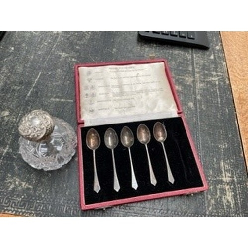 105 - Silver topped glass perfume bottle and boxed set of 5 silver spoons.