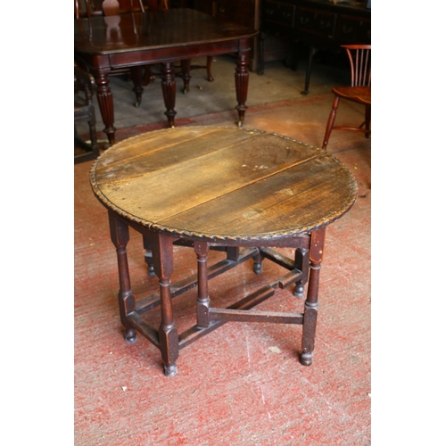 839 - Early 19th century oak Pembroke table, the oval top with piecrust edge, single drawer, raised on tur... 