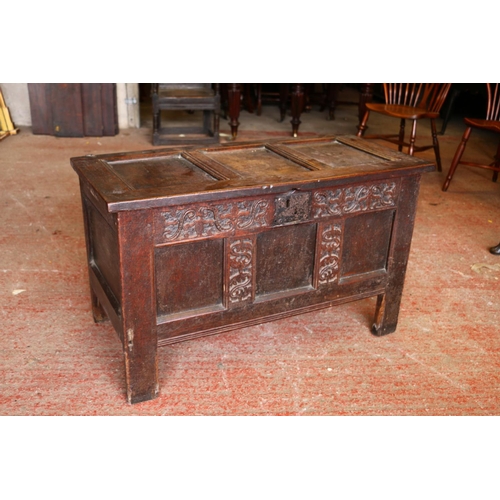 840 - 17th century oak coffer, the panelled top on later hinges, interior with candle box lacking lid, fro... 