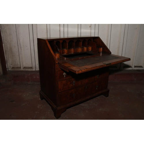 843 - Queen Anne mahogany and walnut bureau, the fall front with a feather banded walnut panel before inte... 