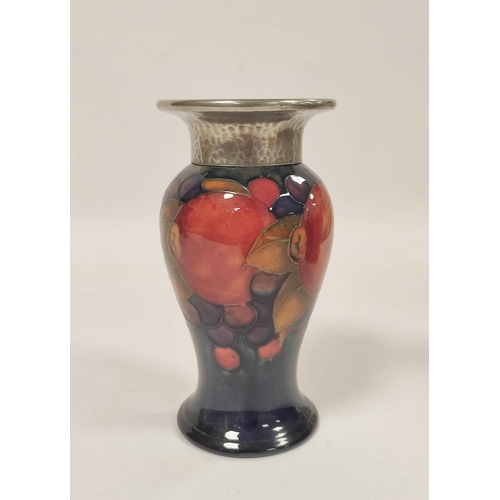 256 - William Moorcroft Pomegranate design Tudric pottery vase for Liberty & Co, the baluster shaped v... 