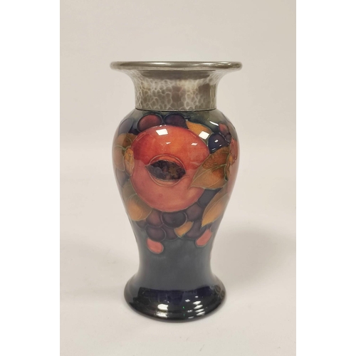 256 - William Moorcroft Pomegranate design Tudric pottery vase for Liberty & Co, the baluster shaped v... 