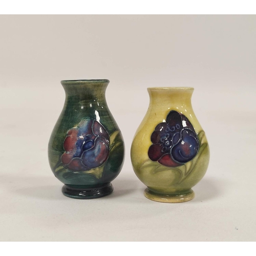 258 - Two William Moorcroft miniature pottery vases, tube lined, in the Hibiscus and Anemone design, stamp... 