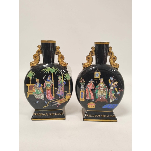 262 - Pair of Dudson jet ware type aesthetic movement  pottery moon flasks, with gilt rim and gilt dolphin... 