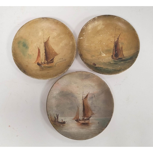 285 - Three Linthorpe Pottery plates, the near matching plates gilded and printed with scenes of ships at ... 