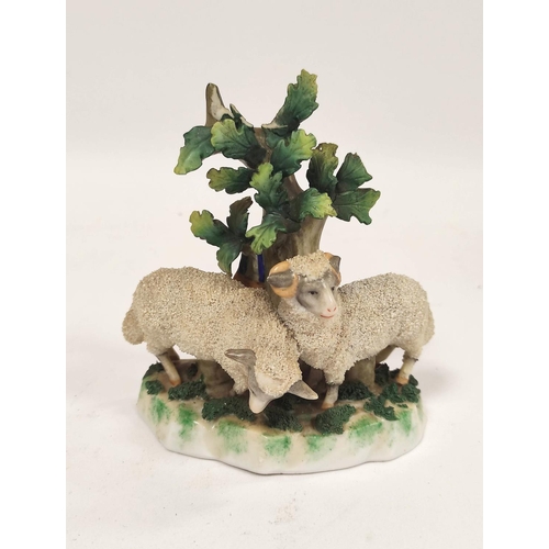 289 - Early 19th century Staffordshire figure group, modelled as two lambs next to a tree, raised on encru... 