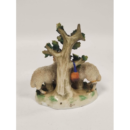 289 - Early 19th century Staffordshire figure group, modelled as two lambs next to a tree, raised on encru... 