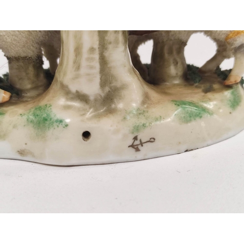 289 - Early 19th century Staffordshire figure group, modelled as two lambs next to a tree, raised on encru... 