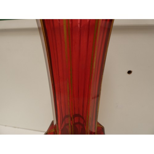 148 - Cranberry glass vase with enamel panels and six cranberry glass wine glasses.