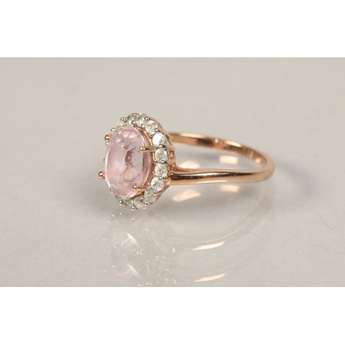 46 - 9ct rose gold ring set with white stones and a centre pink stonering size O