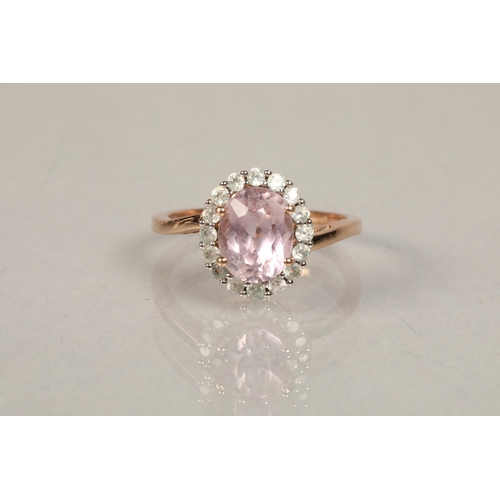 46 - 9ct rose gold ring set with white stones and a centre pink stonering size O