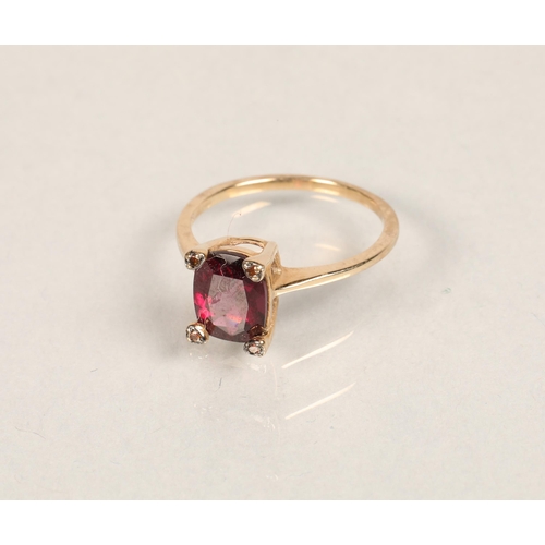 55 - Ladies 9ct gold dress ring with four orange stones surrounding large purple stonering size O