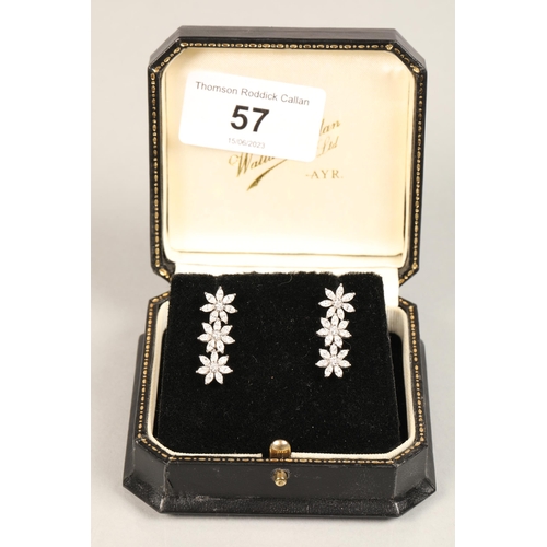 57 - 18ct white gold Diamond cluster 'Lorique' pair of flower design white stone drop earrings