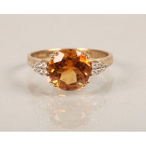 61 - Ladies 9ct gold dress ring set with central orange stone and white stone set shouldersring size N... 