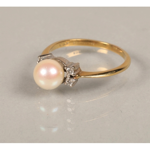 63 - Ladies 18ct gold ring set with a pearl and two small Diamonds at either side ring size N