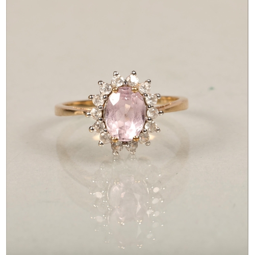 67 - 9ct gold dress ring set pink stone surrounded by white stonesring size O