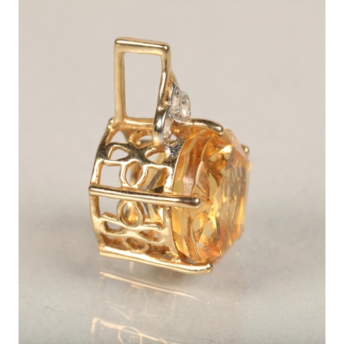 72 - 10ct gold pendant set with large citrine  and three small Diamonds