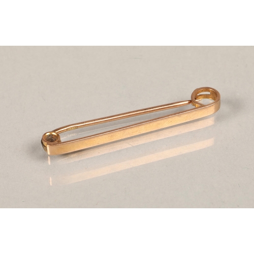 77 - 9ct gold safety pin weight 2g